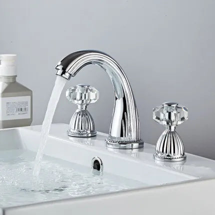 Chrome-finished Tuqiu gold brass basin faucet with three crystal handles for hot and cold water in a bathroom sink
