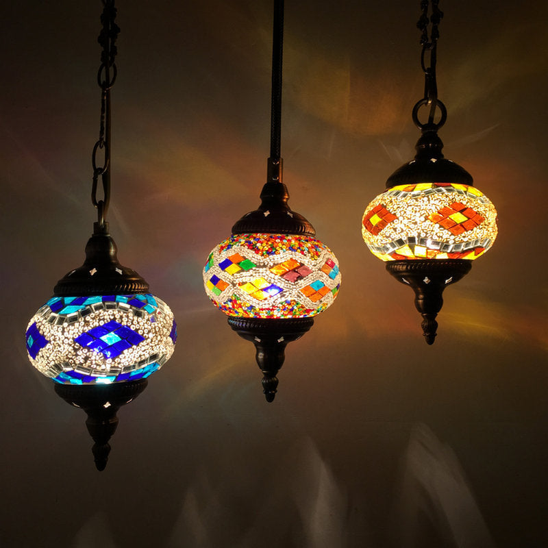 Mosaic glass pendant light with intricate geometric patterns and dark metal accents.