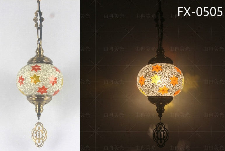 Mosaic globe pendant light with floral patterns and ornate metal accents.