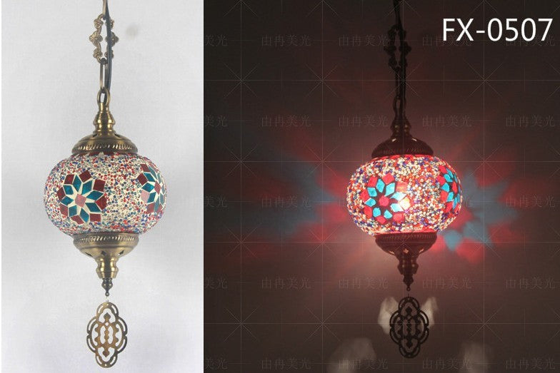 Mosaic glass pendant light with floral patterns and a brass frame.