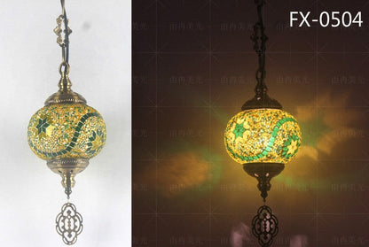 Mosaic glass globe pendant light with intricate patterns and a bronze frame.