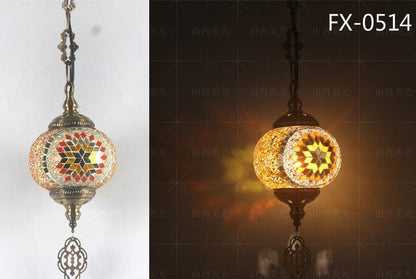 Mosaic glass pendant light with starburst design, multicolored beads and metal accents.