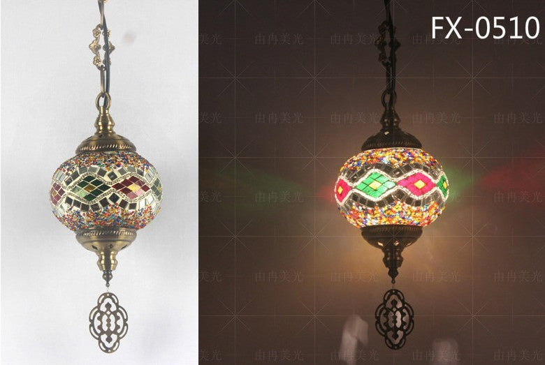 Mosaic glass pendant light with intricate geometric patterns and dangling crystal accents, featuring a bronze frame.