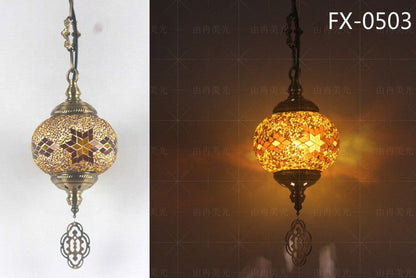 Mosaic glass globe pendant light with star and floral designs, gold accents.