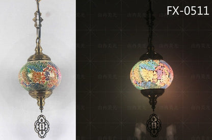 Mosaic globe pendant light with colorful glass tiles and ornate metal accents.