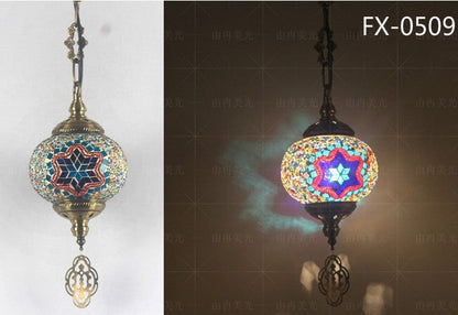 Mosaic glass pendant light with star design, multicolored and bronze accents.