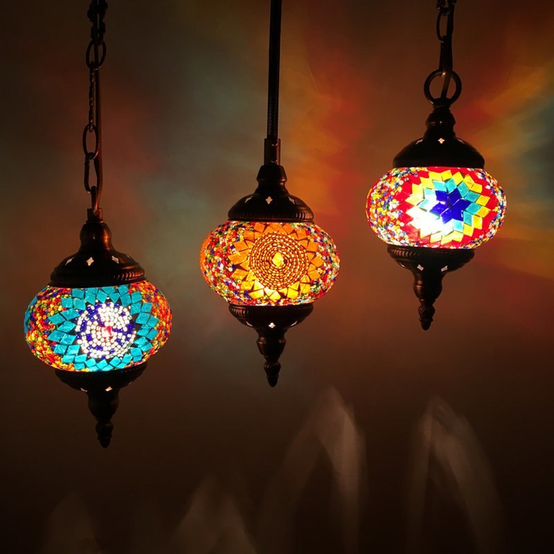 Mosaic pendant light with colorful glass tiles and metal frame, inspired by turkish design.