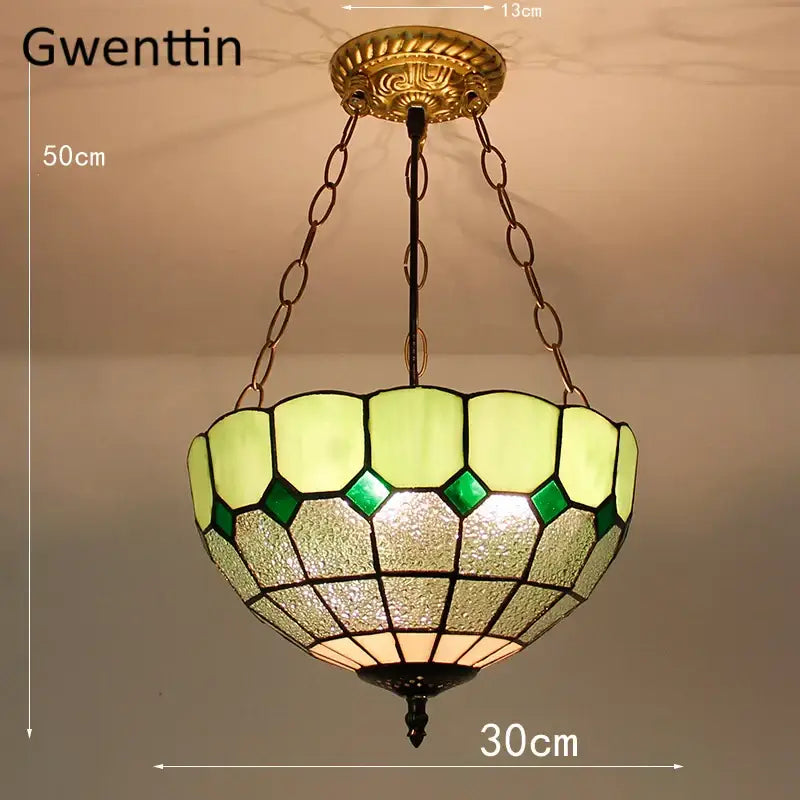 Gwenttin pendant light with diamond square stained pale green and emerald glass panels in dark metal frame for kitchen