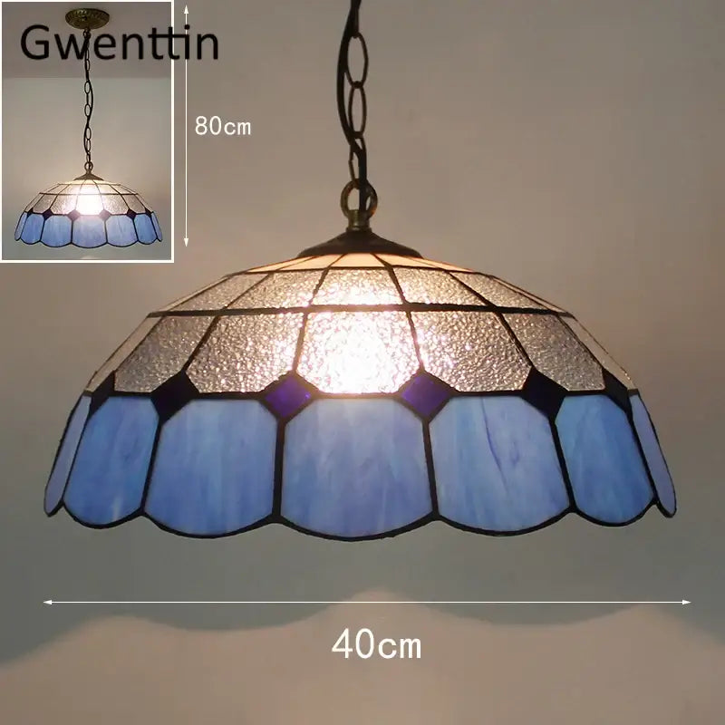 Blue and silver pendant light with scalloped edge design featuring diamond square stained glass for kitchen use