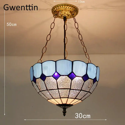 Gwenttin pendant light with turquoise and purple diamond square stained glass shade in octagonal pattern
