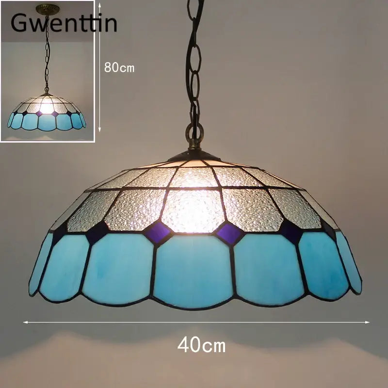 Turquoise and purple diamond square stained glass pendant light with blue and frosted glass dome shade framed in dark metal