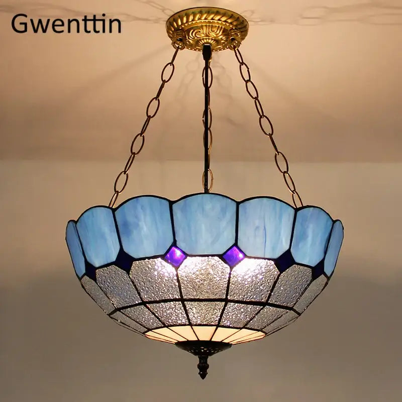 Gwenttin pendant light with turquoise and purple diamond square stained glass shade in blue and silver tones