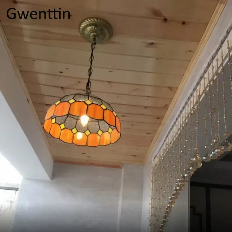 Orange and yellow diamond square stained glass pendant light with brass ceiling mount for kitchen use