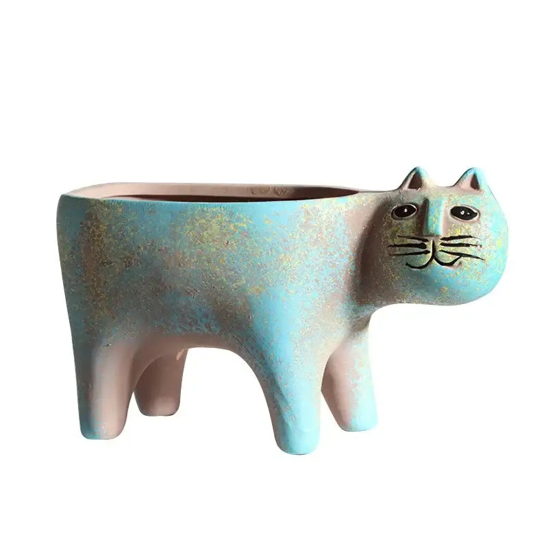 Turquoise and beige ceramic succulent plant pot shaped like a stylized cat with painted facial features for decor