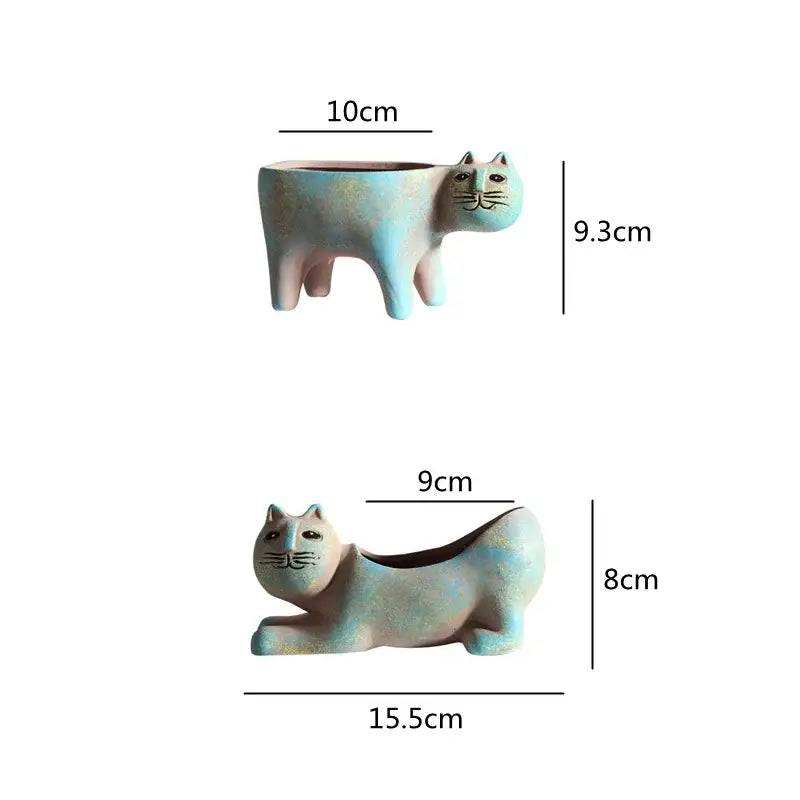 Turquoise ceramic cat succulent plant pot with soft blue and pink glaze featuring simple black facial details