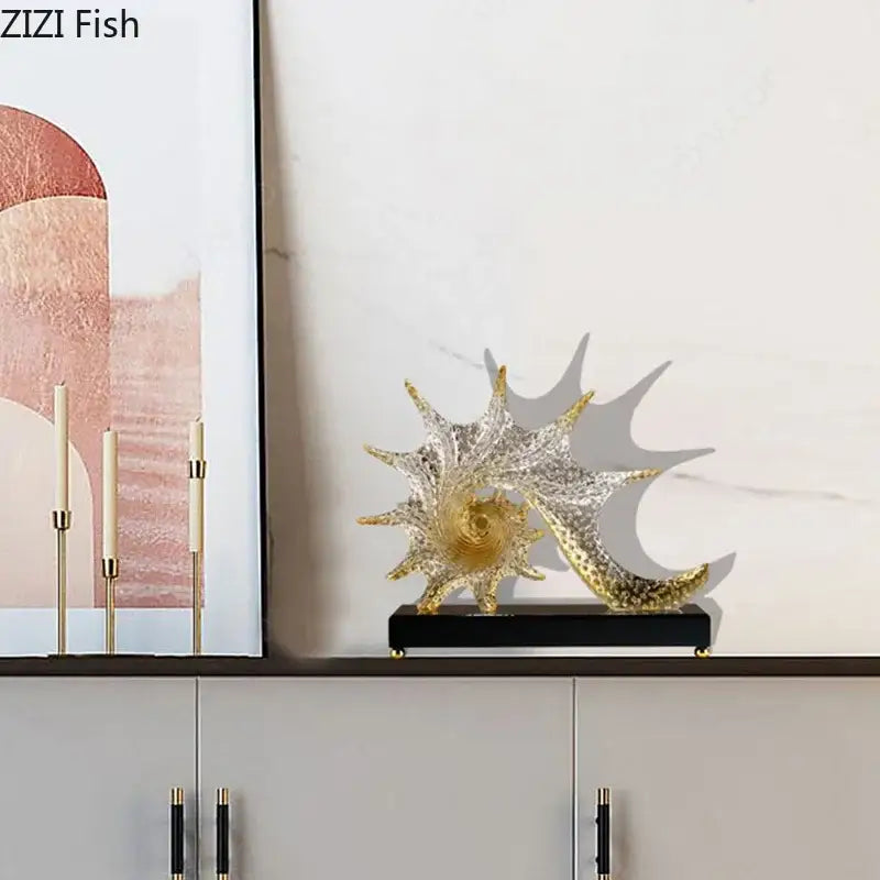 Turquoise and clear glass bubble conch sculpture with gold accents on black base for bedroom aesthetic decor