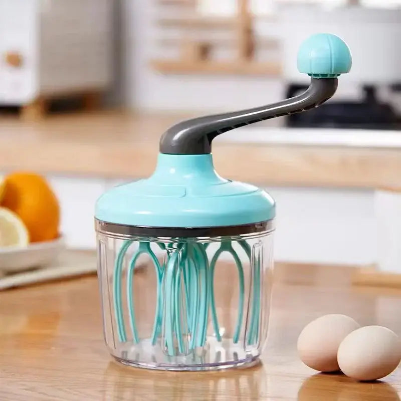 Turquoise plastic hand mixer whisk with clear glass container and teal mixer whisk beater for kitchen use