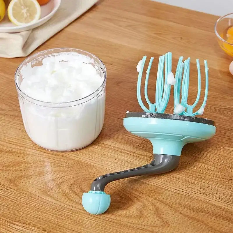 Turquoise and clear hand mixer whisk beater featuring a light blue plastic mixer whisk beater with gray handle for whipping cream or egg whites
