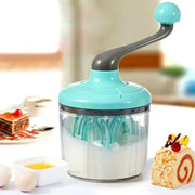 Turquoise plastic hand mixer whisk beater with clear glass bowl and teal whisk attachment for kitchen use
