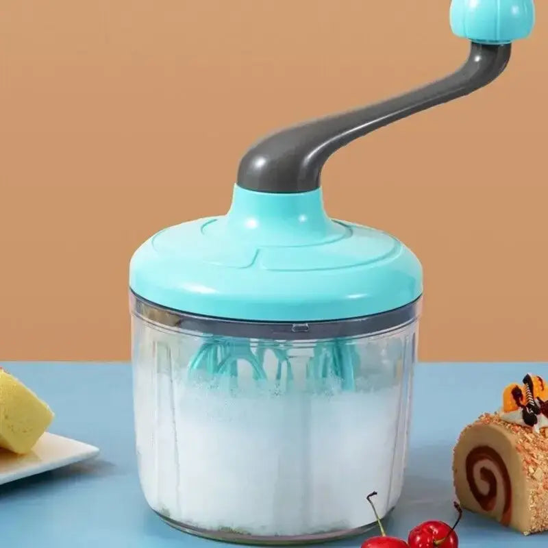 Turquoise and gray hand mixer whisk beater with clear glass container and hand-cranked design for kitchen food processing