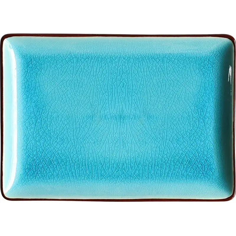 A turquoise crack glaze ceramic plate with a subtle crackle texture and dark brown rim by decorbites blue ice
