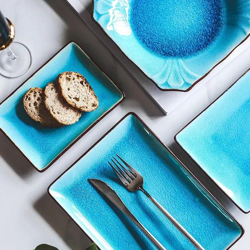 Vibrant turquoise crack glaze ceramic plate with square shape and dark brown rims from decorbites blue ice collection