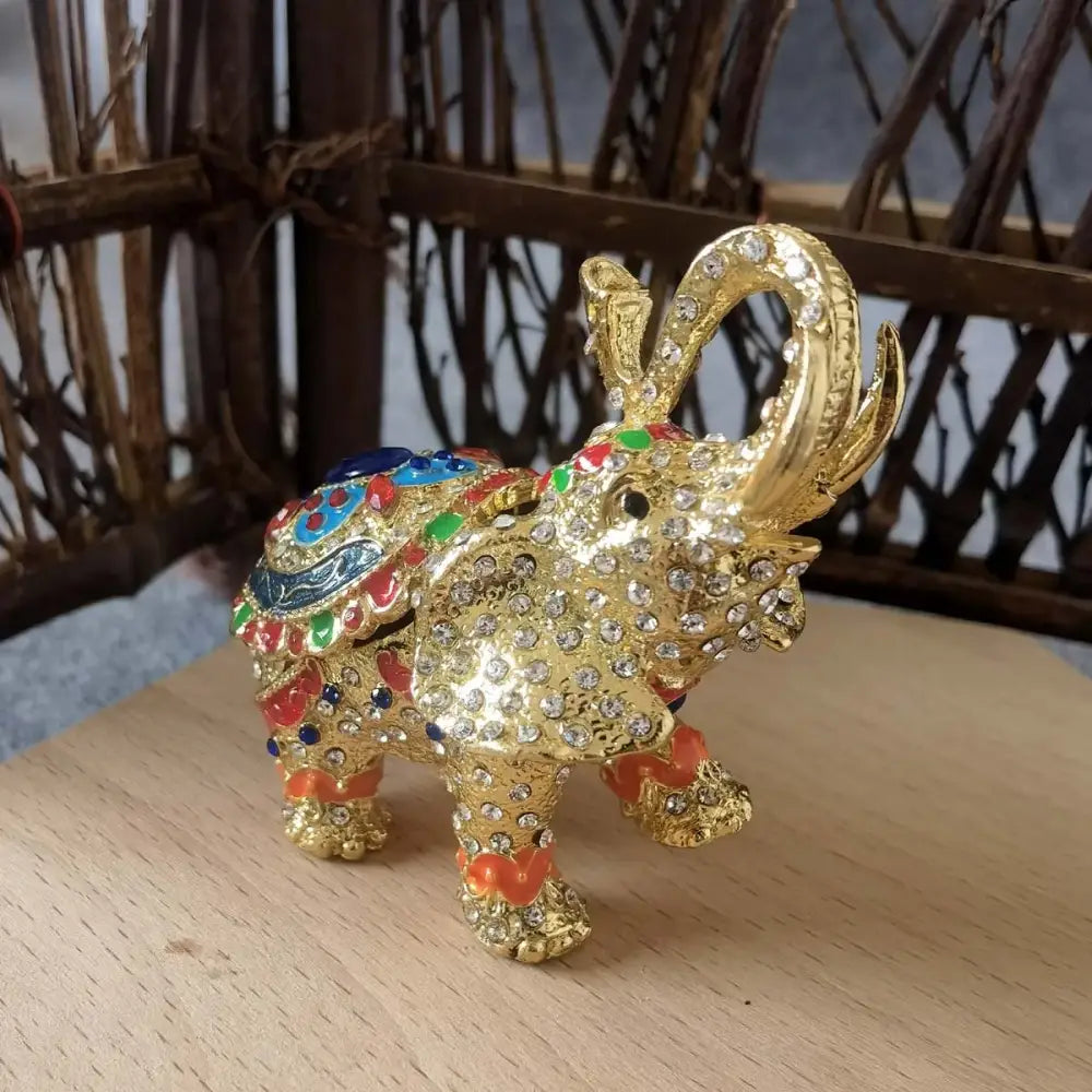 Golden elephant trinket box with sparkling rhinestones and colorful enamel accents from decorbites crystal animal figurines collection