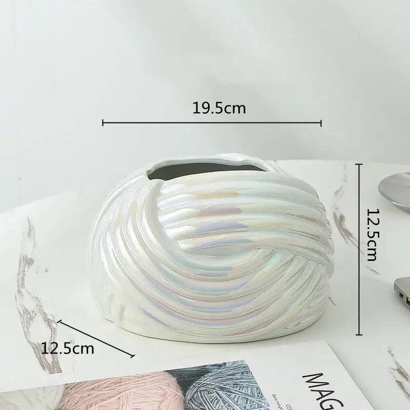 A sleek iridescent white ceramic desktop storage vase with swirling ribbed design for decorbites ceramic desktop use