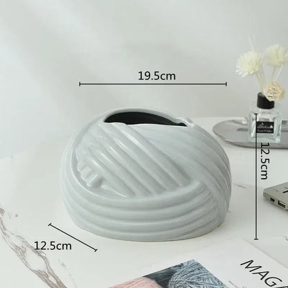 A sleek light gray glossy ceramic desktop storage tissue box with concentric ridges from decorbites ceramic desktop decor