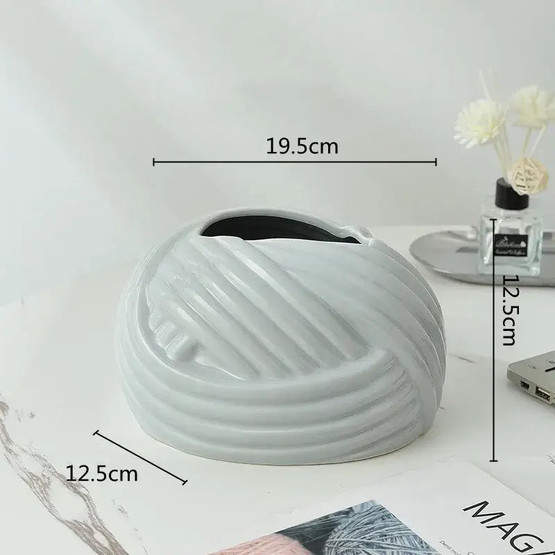 A sleek light gray glossy ceramic desktop storage tissue box with concentric ridges from decorbites ceramic desktop decor