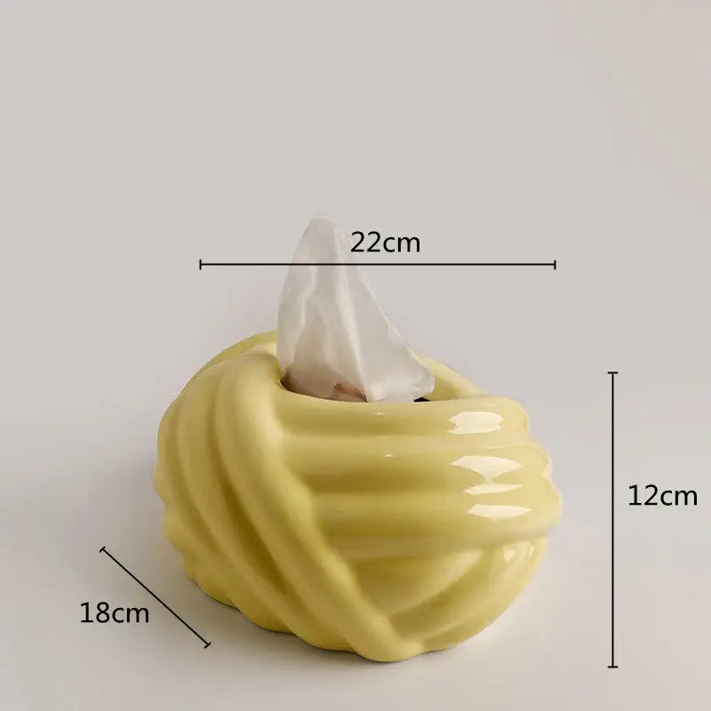 A glossy yellow ceramic desktop storage tissue box with twisted ribbed design ideal for decorbites ceramic desktop use