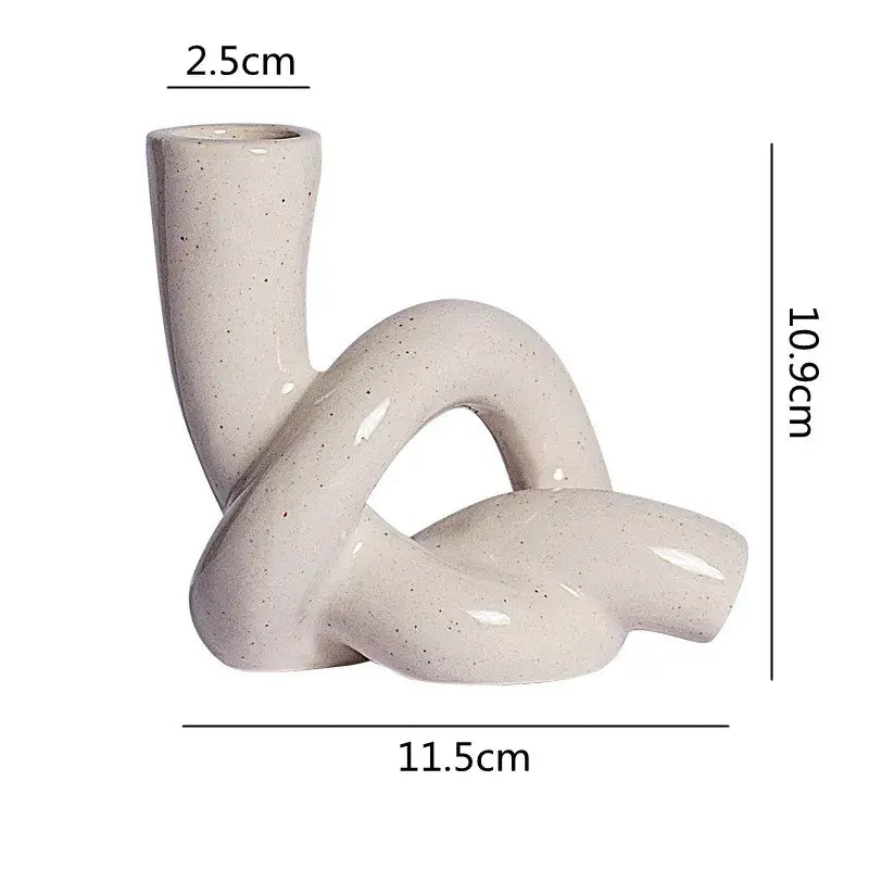Twisted knot cream ceramic desktop storage tissue box with speckled glaze and flowing curves for living room decorbites ceramic desktop