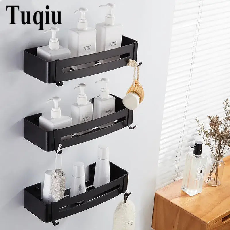 Black aluminum bathroom two tier corner shelf with hooks and three tiers holding white pump bottles by decorbites