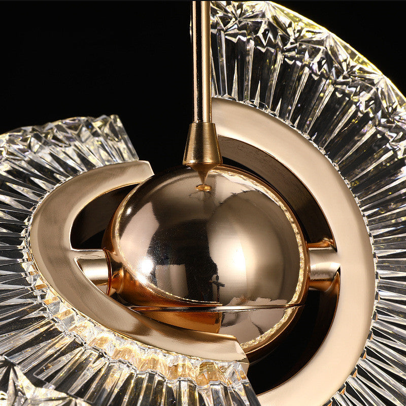 Gold crystal pendulum clock with polished brass finish and intricate cut glass design for ufo bedroom chandelier