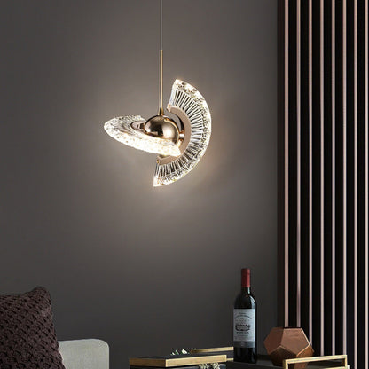 Gold and clear glass pendant light with a modern, geometric design.