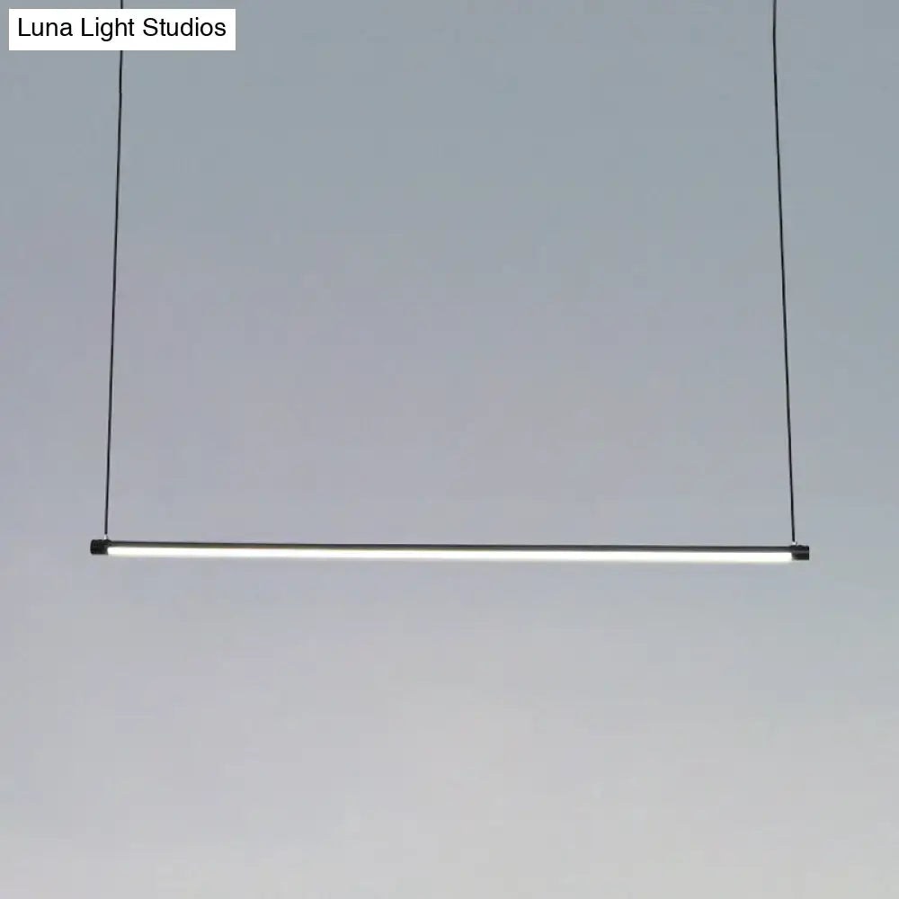Minimalist black ultra slim tube led office hanging lamp with frosted glass diffuser providing warm white light for dining rooms