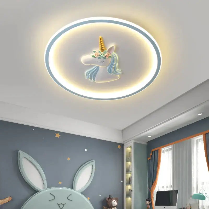 Circular cartoon kids ceiling light featuring a white unicorn with golden horn and blue mane for kids ceiling lights decorbites