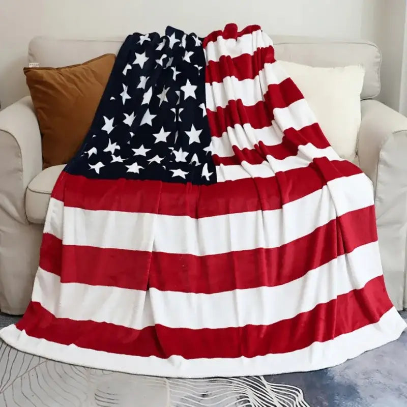 A plush red white and blue throw blanket made of decorbites cozy flannel with a soft fleece texture for living room decor