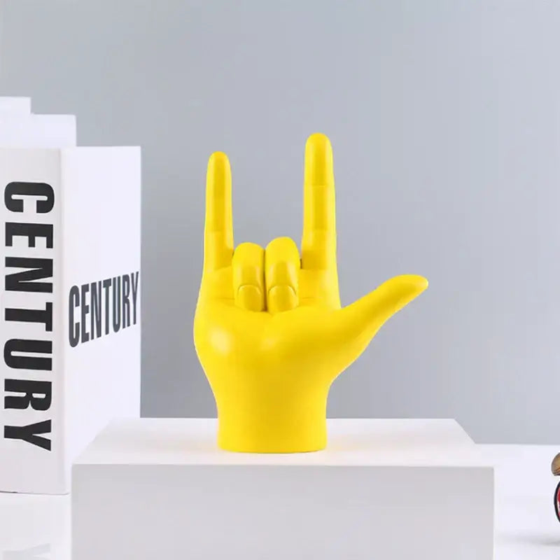 Vibrant yellow resin decorbites abstract hand love sculpture making rock gesture for living room decor