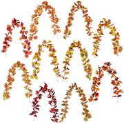 Vibrant autumn harvest hanging decoration featuring fall-themed artificial leaf garlands in red orange and yellow hues decorbites harvest home decorbites harvest