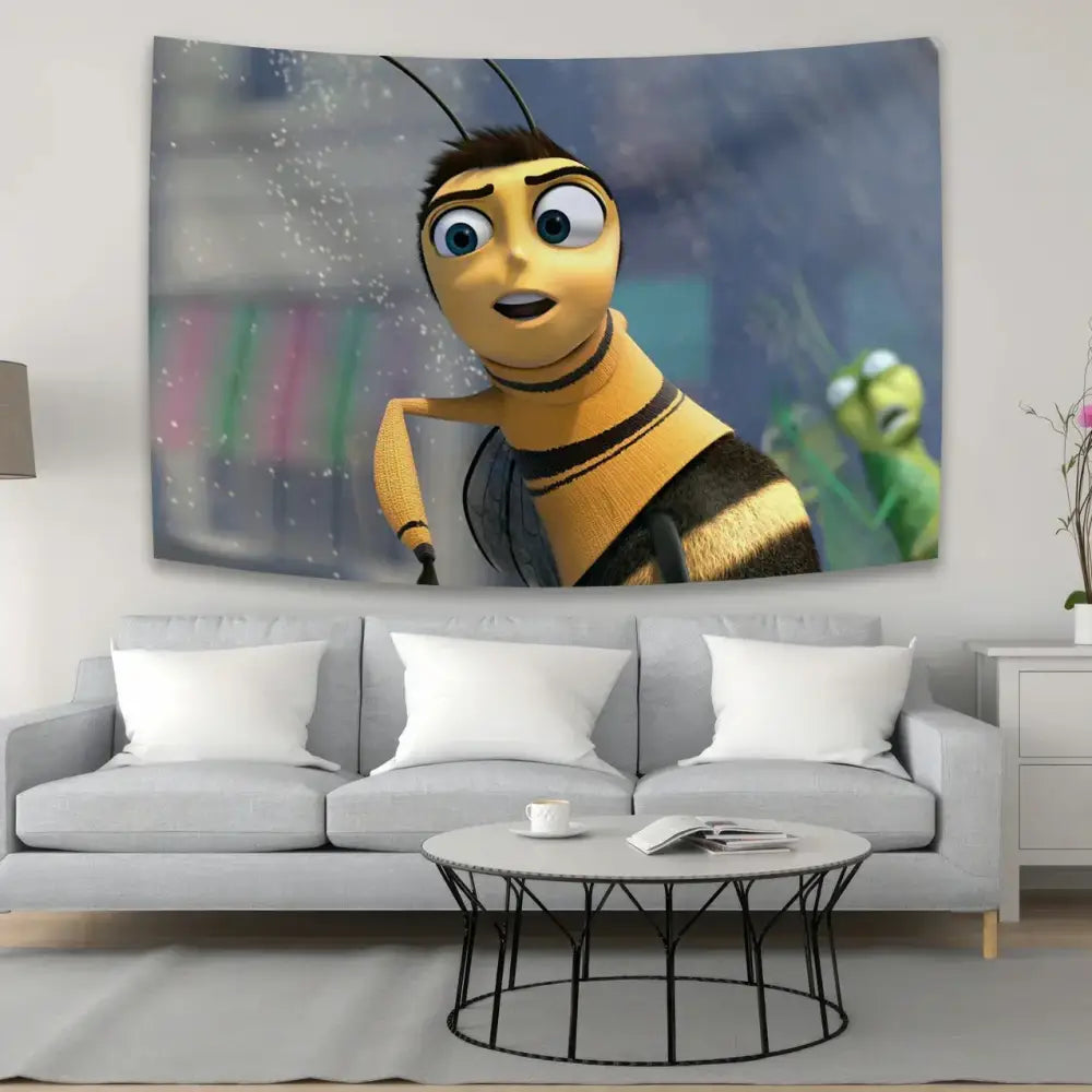 Vibrant yellow and black bee movie meme tapestry art featuring cartoon design hanging above gray sofa in living room decor