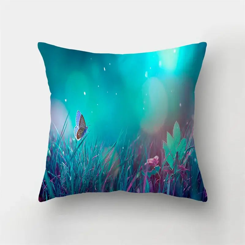 A vibrant butterfly flower pillow case with a blue butterfly on grass under a teal and purple twilight sky for decorbites