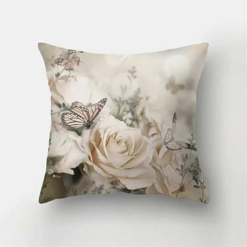 A square butterfly flower pillow with cream roses and beige butterflies in a muted floral design for living room decorbites decor