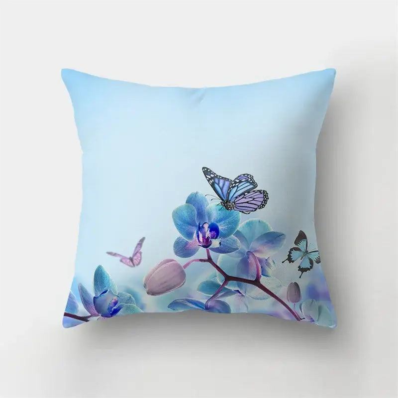 Vibrant butterfly flower pillow case with light blue background featuring purple teal orchids and colorful butterflies for decorbites decor