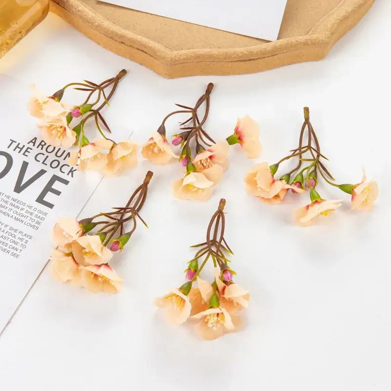 Delicate peach-colored decorbites artificial flowers with brown stems and green buds for living room floral decor