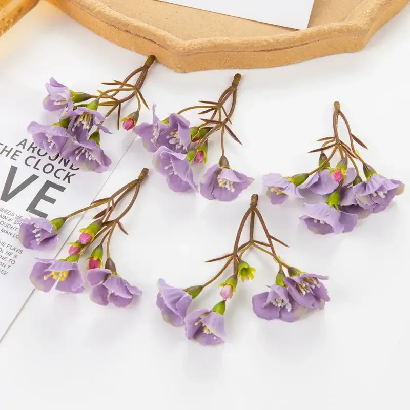 Vibrant cherry blossom artificial flowers with purple petals, brown stems, and pink buds for living room decorbites artificial decor