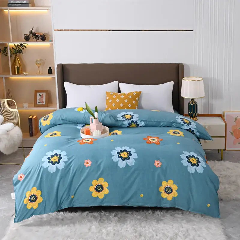 Blue floral comforter duvet cover bedding set with yellow white and orange flowers on teal background for bedroom decor