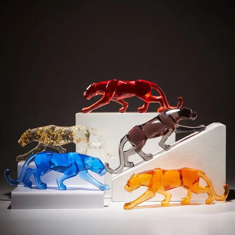 Vibrant translucent glass animal sculptures in red blue orange and gold with glitter accents for decorbites leopard cheetah decor