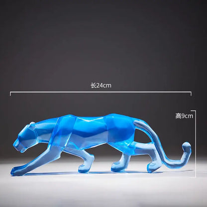 A translucent blue geometric panther figurine with faceted surfaces from decorbites leopard cheetah animal sculptures collection