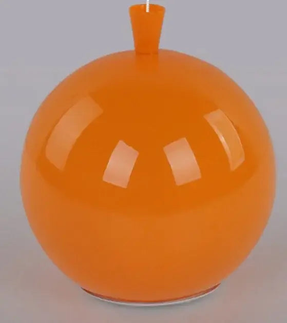 Vibrant orange glossy pendant light with spherical shape and cylindrical stem for childrens bedroom installation